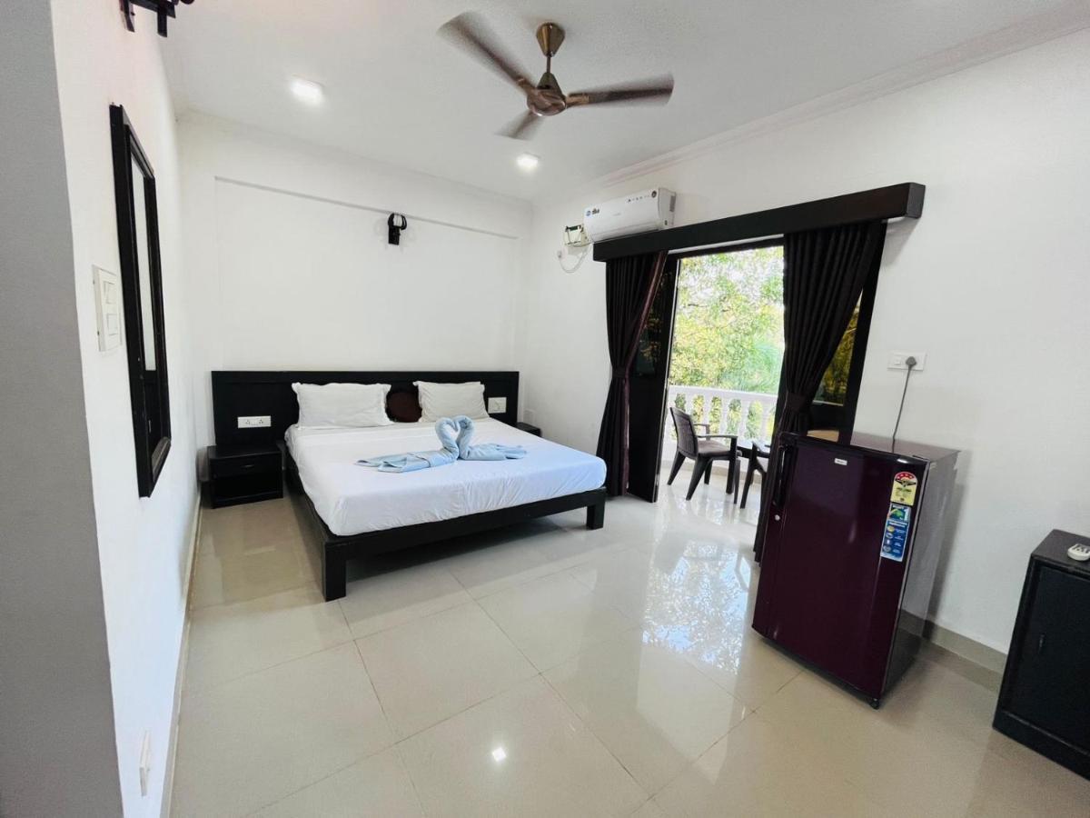 Naga Cottages Morjim Extérieur photo