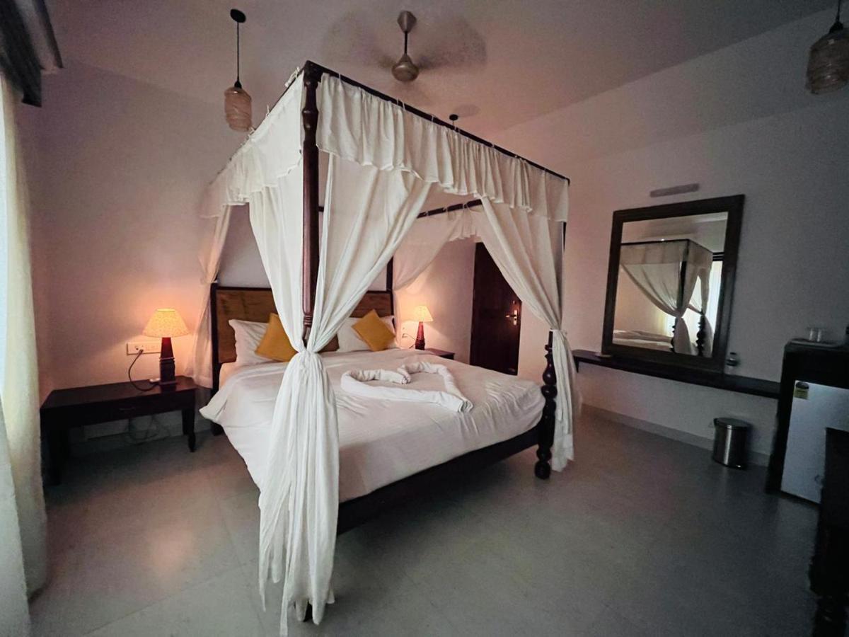 Naga Cottages Morjim Extérieur photo
