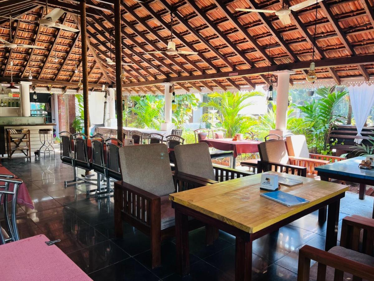 Naga Cottages Morjim Extérieur photo